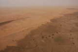 Photo: The boundary between the overgrazed sandy rangeland and the threatened rain-fed agricultural zone is quite marked here.
